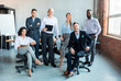© Prostock-studio - Group Of Successful Business People Posing At Workplace In Office