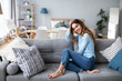 © BestForYou - Beautiful woman relaxing on sofa at home.