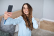 © BestForYou - Girl influencer posing for selfie.