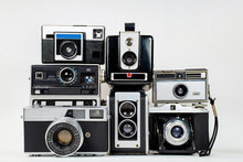 Collection Of Retro Cameras On Isolated Background