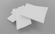© eliahinsomnia - exploding pile of white din a4 paper sheets flying isolated on grey to replace your design 3d render illustration