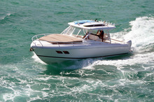 Well Appointed Small White Fishing Boat Powered By Three Outboard Engines