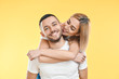 © GVS - Happy smiling couple in love on yellow background