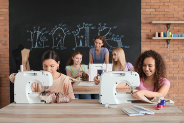 Poster - Young women during tailor's class in atelier