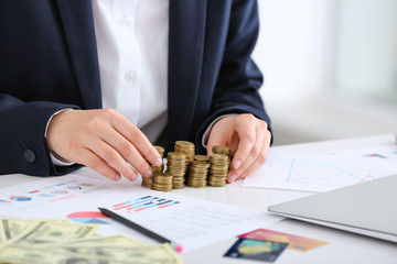 Sticker - Bank manager with coins on table, closeup