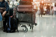 Men and luggage and luggage trolley with luggage cart in the international airport.