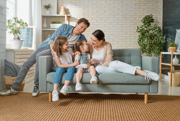 Poster - Two children with mother and father.