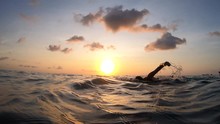Action Cam Outdoor Follow The Swimmer Floating Crawl In Slow Motion In Sunset Time