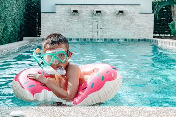 Wall Mural - Holiday, vacation concept, Children swimming in the pool are very fun.