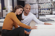 © Ihor - Happy young multiethnic couple choosing a new bed to buy at furniture store. Love, family, living together concept