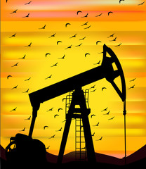 Oil pump on a sunset background. World Oil Industry