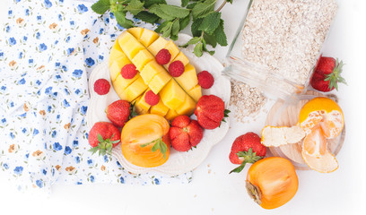 Mango, persimmon, strawberry, Obyanka in the bank. Different fruits on a white background. Detox nutrition for health. Free space for text. Copy space. Above. Square