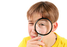 Boy With A Magnifying Lens