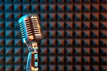 Retro Microphone On Acoustic Foam Panel Background,