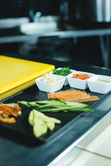 Wall Mural - Photo of Chef preparing rolls in kitchen, fresh and tasty japan food