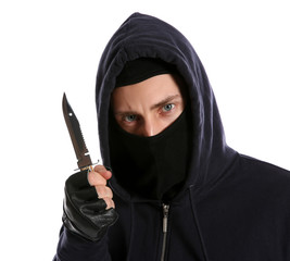 Wall Mural - Man in mask with knife on white background. Dangerous criminal