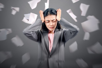 Wall Mural - Asian businesswoman with headache expression