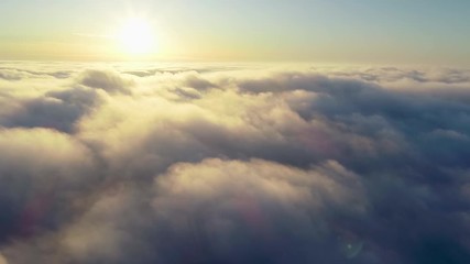 flying over the evening timelapse clouds with the late sun. seamlessly looped animation. flight thro