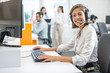 © Bojan - Professional helpline call center agent operator woman wearing headset working in customer care support service