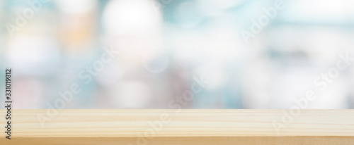 Fotomural wood plank table top on blur and bokeh abstract in the department store with blu