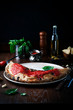 Calzone pizza with fresh ingredients and vegetables