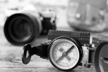 Compass and camera on the table