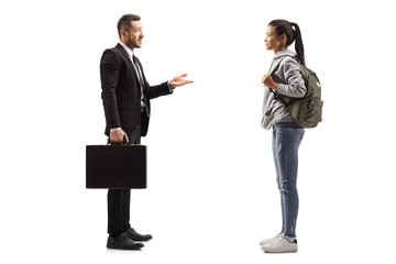 Canvas Print - Businessman talking to a female student