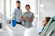 © Halfpoint - Annual dental check-up of a child with father in dentist surgery.