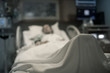 © kieferpix - Sick woman in hospital bed unrecognizable.