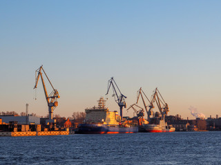 view of the cargo port with floating cranes