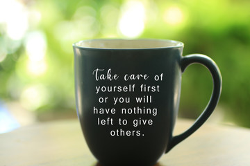 Inspirational quote - Take care of yourself first or you will have nothing left to give others. With text on an empty cup on bright green background. Love yourself concept.