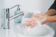 Hygiene. Cleaning Hands. Washing Hands With Soap. Young Woman Washing Hands With Soap Over Sink In Bathroom, Closeup. Covid 19. Coronavirus.