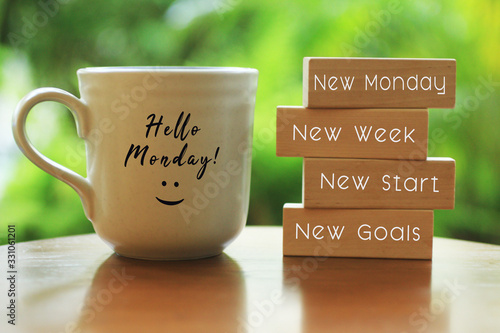 Fotomural Hello Monday concept with inspirational quote on wooden blocks - New Monday