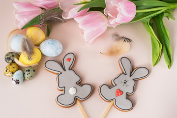 Wall Mural - Easter gingerbread on sticks in the form of rabbit, gift, eggs, flowers