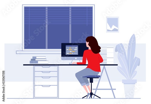 Fotomural Woman sitting at table and working at home.