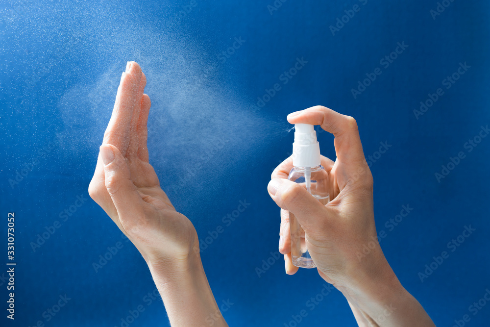 Alcohol spray for disinfecting hand washing against viral bacteria. - obrazy, fototapety, plakaty 