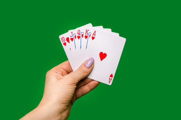 Poker cards on green background