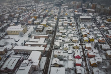 Morning Aerial Winter Panorama Of Siska, A Suburban Part Of Ljubljana, Capital Of Slovenia, With The Church And Other Bigger Houses Visible. Hazy Cold Winter Weather In Ljubljana Some Snow