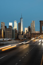 Lower Manhattan Skyline From Brooklyn Bridge At Sunrise
