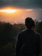 © FabianSchmiedlechner - Over shoulder view of woman looking at sunset over city