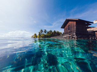 tranquil landscape of nature resort at exotic island with beautiful seashore and wooden bungalow for