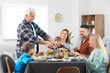 © Pixel-Shot - Family celebrating Thanksgiving Day at home