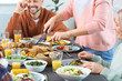 © Pixel-Shot - Family celebrating Thanksgiving Day at home