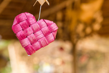Pink Bamboo Wood Heart Over Blurred Background, Love And Romance Concept, Valentine Background Idea, Craft Item