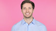 © stockbakers - Smiling Young Man Isolated on Pink Background