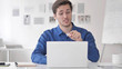 © stockbakers - Young Man Discussing During Video Chat at Work