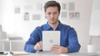© stockbakers - Casual Adult Man Using Tablet in Office