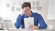 © stockbakers - Adult Man Upset by Online Loss on Tablet