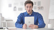 © stockbakers - Casual Adult Man in Shock while Using Tablet