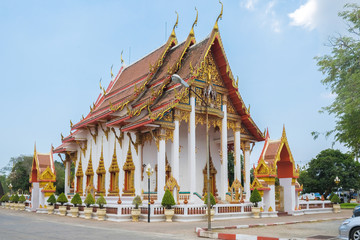 Buddhist temple with Buddha statues on a green background